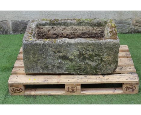 A SANDSTONE TROUGH of rough hewn oblong form, 34 1/2" x 24" x 14" (Est. plus 21% premium inc. VAT)Attractive trough in very g