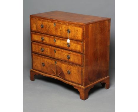 A GEORGIAN WALNUT CHEST, early 18th century and later, the moulded edged and banded top over four long drawers with plain and