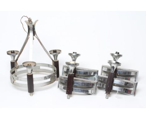 AN ART DECO LIGHT PENDANT in bakelite and plated chrome, the two bar circlet joined with roundels and applied with three reed