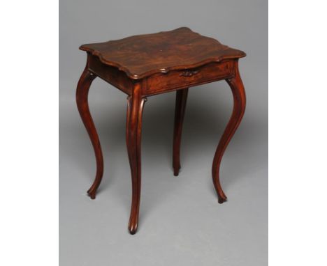 A FRENCH MAHOGANY WORK TABLE, late 19th century, the moulded edged oblong serpentine top opening to a drawer fitted with both