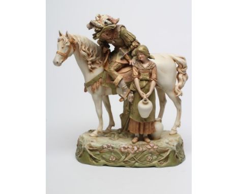 A ROYAL DUX EQUESTRIAN GROUP, early 20th century, the old cavalier seated astride his steed leaning down to a young peasant g