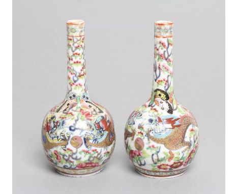 A PAIR OF CHINESE PORCELAIN BOTTLE VASES painted in underglaze blue with a dragon chasing the flaming pearl and overpainted i