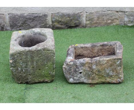 A SMALL SANDSTONE TROUGH of irregular rough hewn oblong form, 20" x 13 1/4" x 10 1/4", together with a square sandstone plant