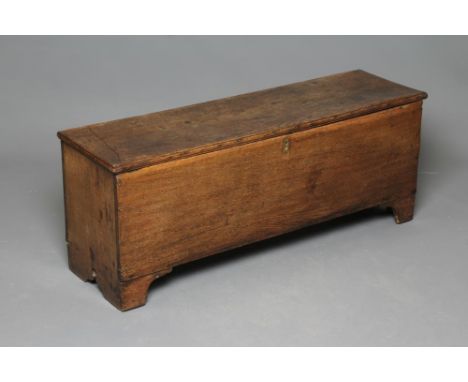 AN OAK BOARDED CHEST, 18th century, the moulded edged and hinged lid opening to interior with small compartments, the sides w