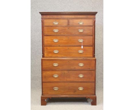 A GEORGIAN MAHOGANY SECRETAIRE CHEST ON CHEST, c.1800, the dentil moulded cornice and banded frieze over two short and three 