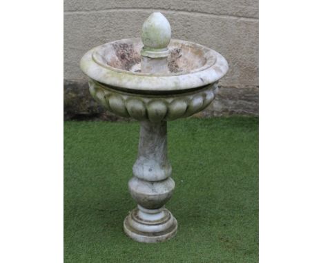 A WHITE MARBLE FOUNTAIN, 20th century, the fluted bowl with moulded rim on baluster stem and moulded circular foot, 17" x 29 