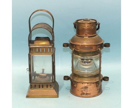 A copper and brass 'anchor' light, 27cm high and another four-glass oil lamp, (2).
