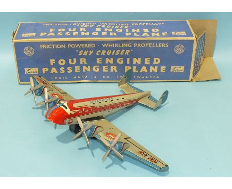 A Marx tinplate no. 858 'Sky Cruiser' friction-powered four-engine Passenger Plane, with siren, c1950, boxed.