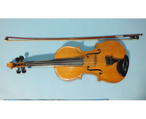 A violin, the two-piece back 35cm long, 58cm (23'') overall, label for Thomas Restell, Wokingham, Oct 1980, in case with bow 