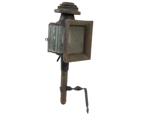 An early 20thC carriage lantern, with compressed circular top, on cylindrical stem, 58cm H. 