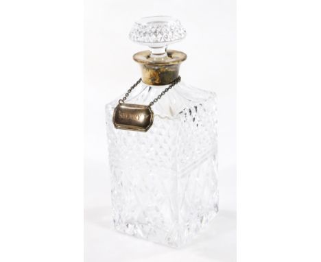 A 20thC decanter, with silver collar, of square shouldered outline, with compressed stopper, partially hobnail cut, 24cm H an