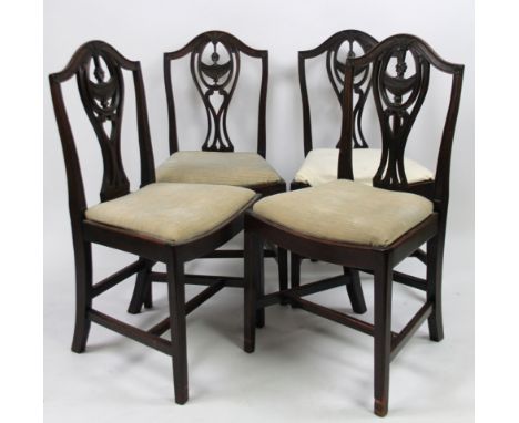 A set of four 19thC mahogany Chippendale revival dining chairs, with curved top rails, pierced oval back splats and drop in s