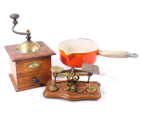 An early 20thC brass postal scale, on a serpentine oak stained stand, 18cm W, an Le Creuset pan and a late 20thC coffee grind