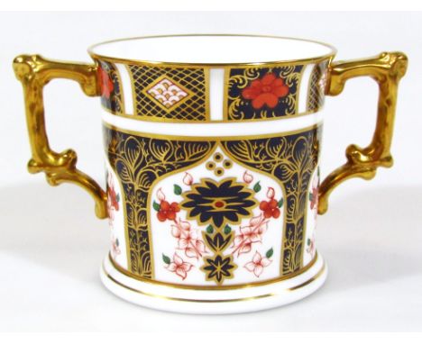 A Royal Crown Derby Imari pattern loving cup, with cylindrical body on circular foot, no. 1128, printed marks beneath, 8cm H.