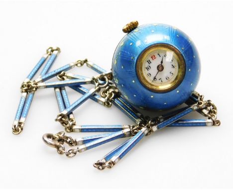 An enamel pendant watch, the egg shaped watch pendant with small circular dial, 11mm W, white enamel, with gold motifs, and b