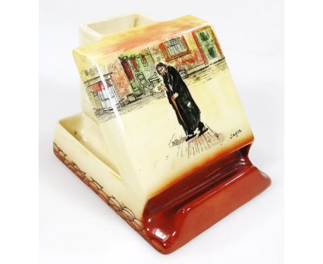 A Royal Doulton Dickens Seriesware Artful Dodger vesta stand, transfer printed in colours, with a back match stick holder on 