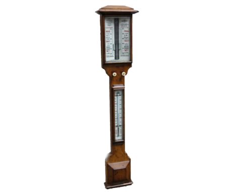 An Edwardian oak stick barometer, marked Reynolds &amp; Branson, Leeds, in shaped case, with central thermometer and ivory kn