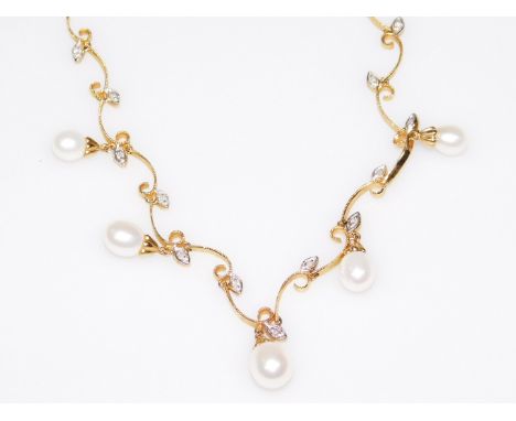 A pearl and diamond necklace, set with tiny illusion set diamonds, and cultured pearl drops, yellow metal, the clasp marked 1