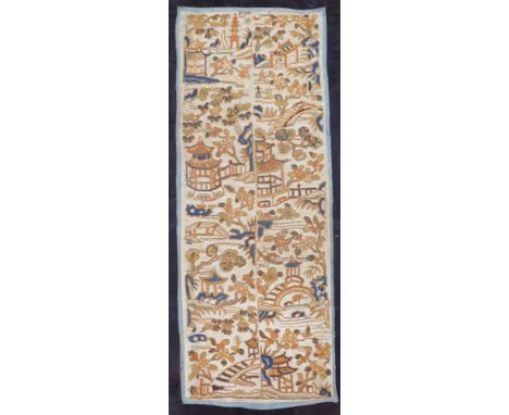 A Chinese Qing period silk port shoulder decoration or double epaulette, decorated with buildings and flowers, raised with co