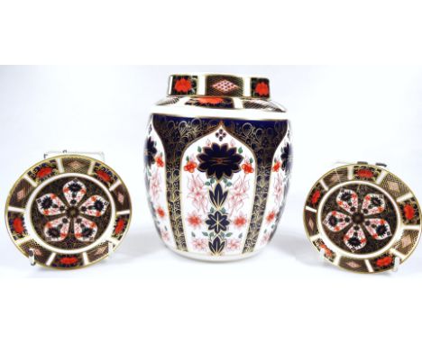 A Royal Crown Derby Imari pattern jar and cover, no.1128, printed marks beneath, 20cm H, and two similar design saucers. 