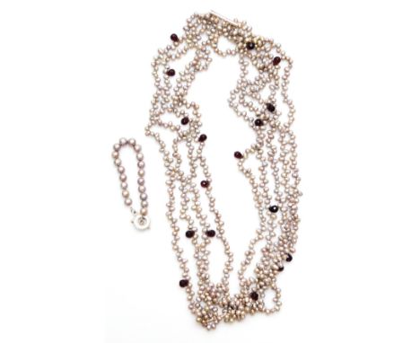 Two items of modern pearl jewellery, to include a pearl bracelet, with silver clasp, and a faux pearl, nine strand decorative