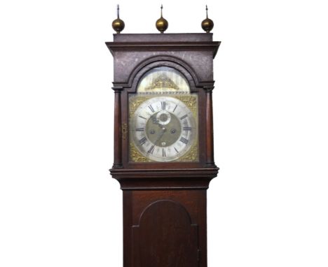 A George III oak longcase clock, with caddy top hood, orb and spike finials, and brass 30cm square arched dial having Royal c