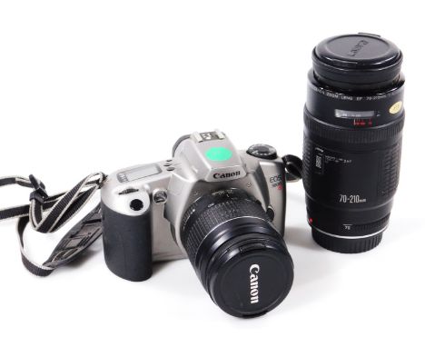 A Canon digital lens, 15cm H, and a E05000N camera. (2)