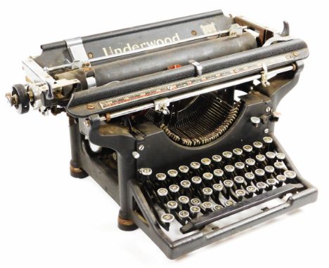 An early 20thC Underwood typewriter, in black and chrome type trim, 28cm H.