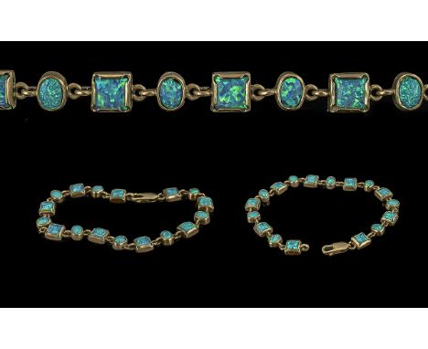 Ladies - pleasing 9ct gold opal set bracelet, marked 9.375, well matched blue / green opals, length 7.5 inches - 18.75 cms, w