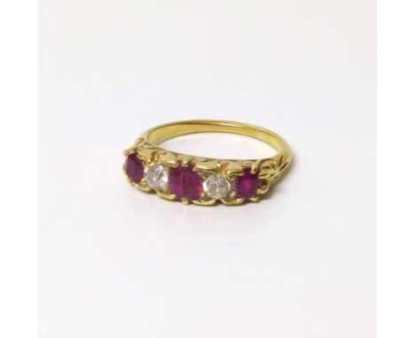 A ruby and diamond 18ct gold boat head ring Condition report: see terms and conditions.