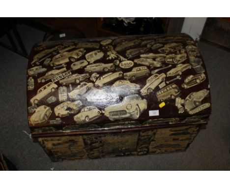 A LARGE TRUNK DECORATED IN A STYLE WITH AUTOMOBILES DECOUPAGE