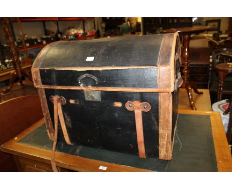 A DOMED LEATHER TRUNK