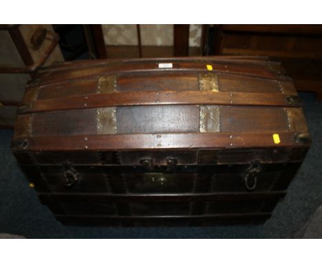 A DOMED BANDED TRAVELLING TRUNK
