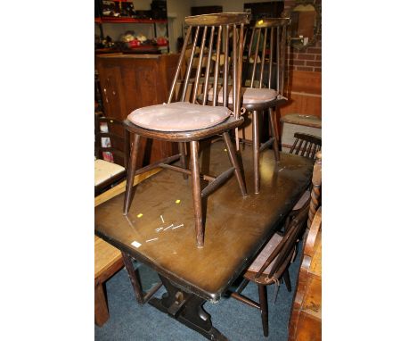 AN OAK DINING TABLE + FOUR ERCOL CHAIRS