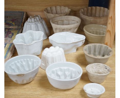 A collection of thirteen various sized 19th and 20th century ceramic jelly moulds,