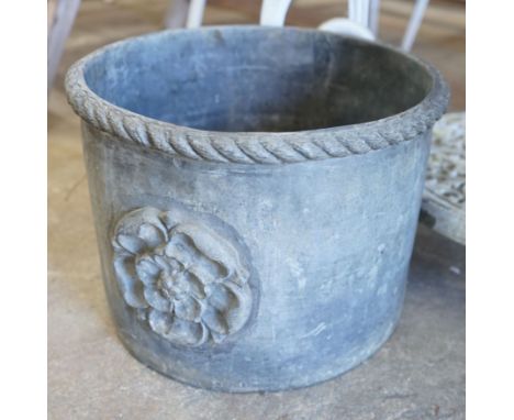 A circular lead planter, diameter 33cm, height 24cm