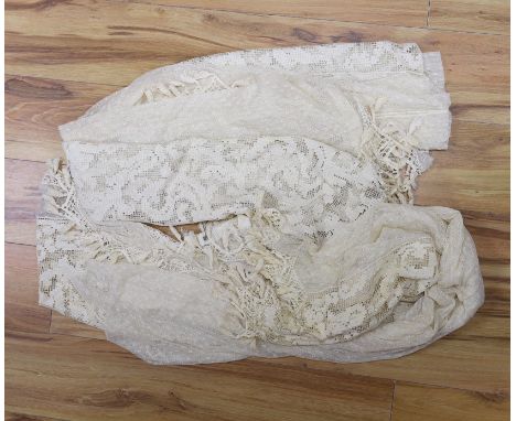 A pair of Edwardian fine net curtains bordered with wide fillet lace, edged with tasselled bobbin lace 272 x 155cm