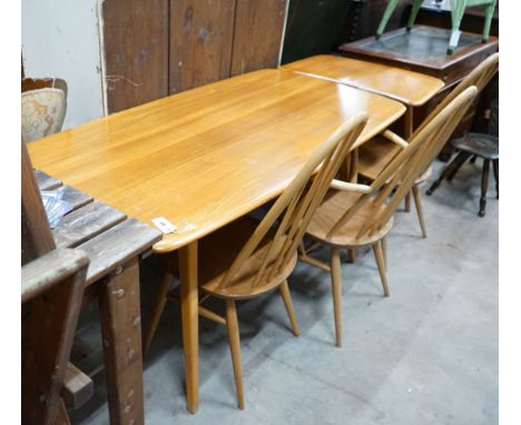 An Ercol rectangular light elm dining table with extension section, length 150cm, depth 76cm, height 72cm and three Ercol elm