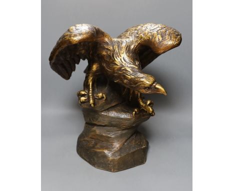 After G V Vaerenbergh, an Austrian large gilded and cold painted ceramic perched eagle - 46cm tall