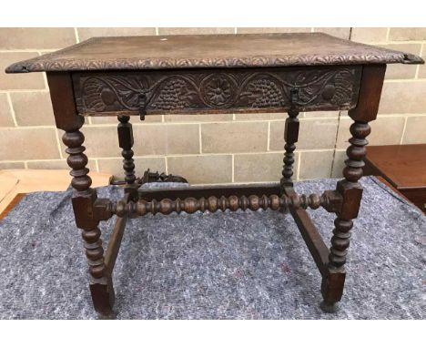 An 18th century oak and later carved side table with drawer, bobbin turned legs, 85cm wide