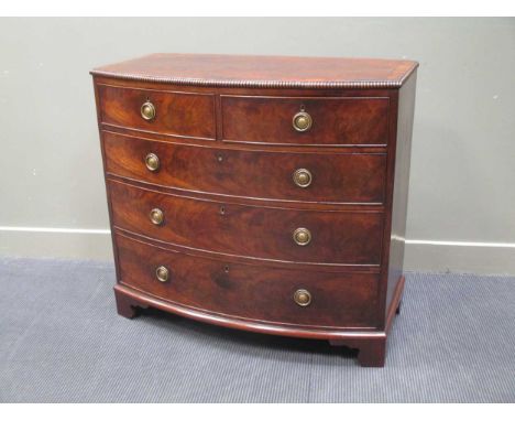 A George III flame mahogany bow fronted chest of two short over three long drawers on bracket feet 98 x 108 x 54cm