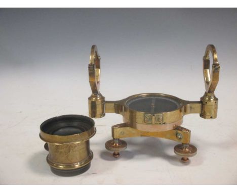 A brass nautical compass and a brass wide angled lense inscribed 'Jonathan Fallowfield, London'
