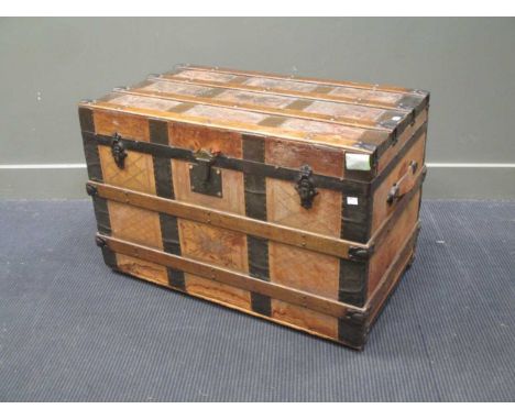 A leather and wooden board travelling trunk with tray interior 87x50