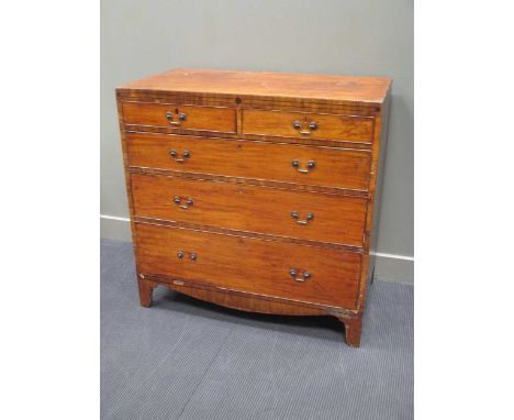 An early 19th century mahogany chest of drawers, with two short over three long graduating drawers on swept bracket feet 106 