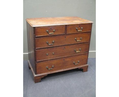 A George III oak chest of drawers, with two short over three long drawers, on bracket feet 88 x 94 x 50cm