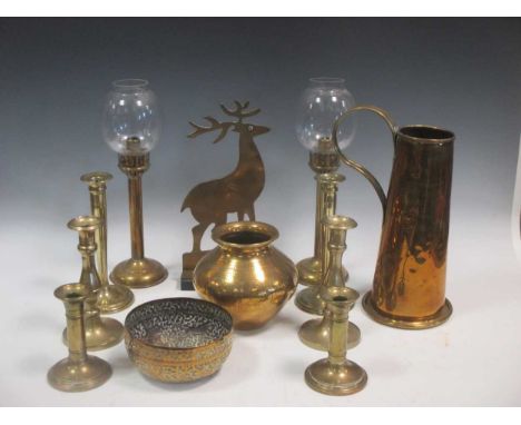 A collection of brass ware to include candlesticks, WWI souvenirs, animals, and a quantity of mantelpiece ornaments in the fo