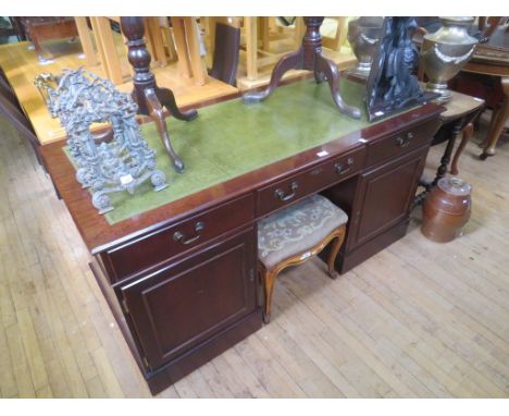 A reproduction mahogany leather inset twin pedestal writing desk 