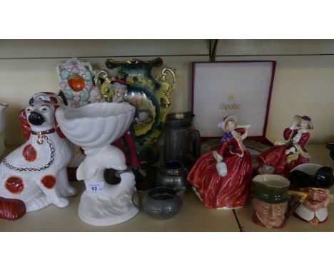 A mixed lot comprising a pair of 19th Century Staffordshire dogs, a Staffordshire figural pocket watch stand, a model greyhou