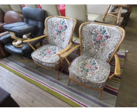 A pair of vintage Ercol lightwood stick back armchairs and accompanying stoolADDITIONAL INFORMATION/CONDITIONwoodwork appears