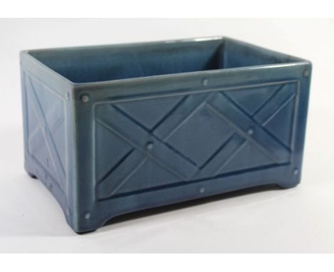 An Aesthetic Movement ceramic planter modelled in the form of a garden trough with relief decoration, indistinct factory mark